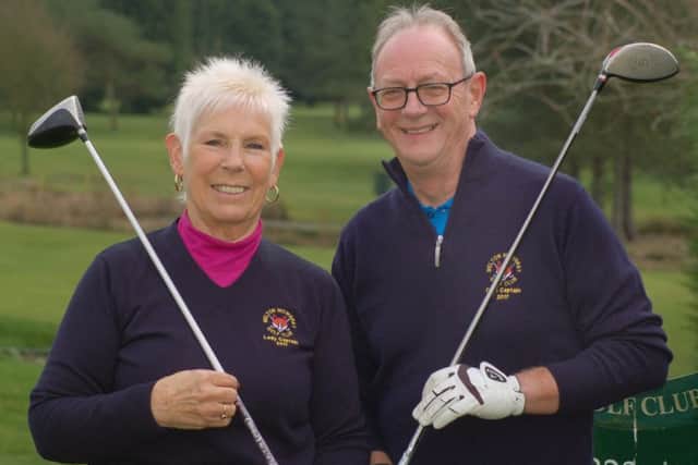 Lady captain Bettyne Norton and club captain Ian Solloway EMN-170131-144042002