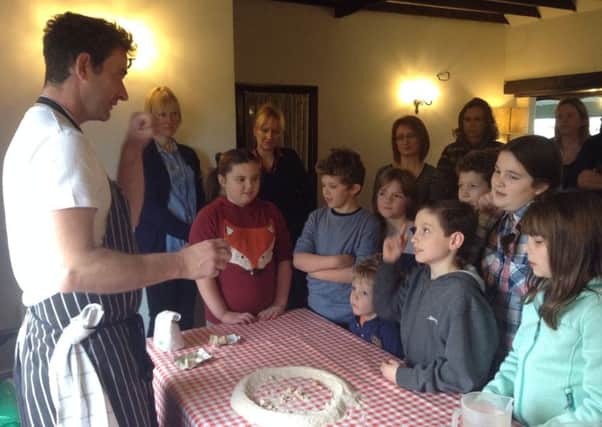 Children receive instruction on how to make bread PHOTO: Supplied