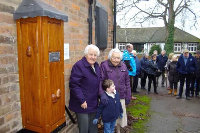 Mrs Vi Spencer, George Fawkes and Mrs Margaret Musson next to the pump PHOTO: Supplied