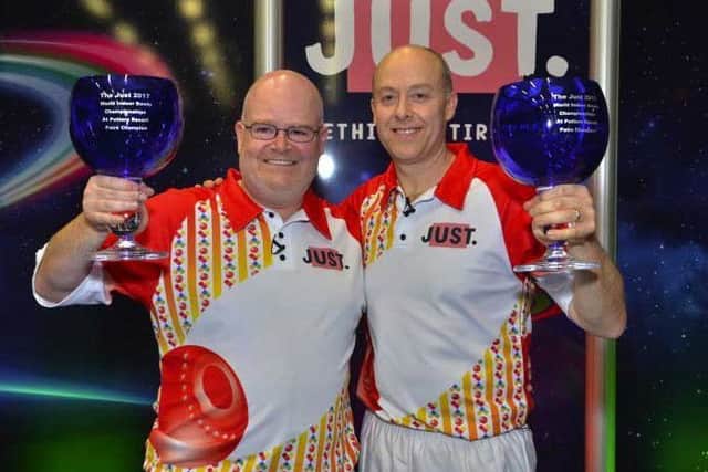 Les Gillett (left) celebrates his second world pairs title with Jason Greenslade EMN-170102-104426002