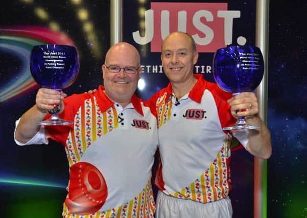 Les Gillett (left) celebrates his second world pairs title with Jason Greenslade EMN-170102-104426002