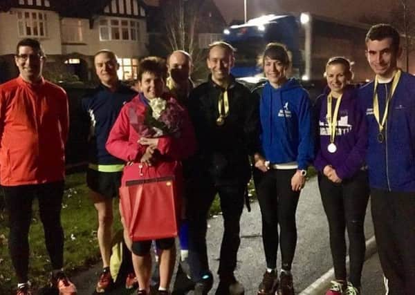 Vicki Lowe, pictured with fellow Striders, received flowers and chocolates for her Leicester 5k series win EMN-170702-120253002