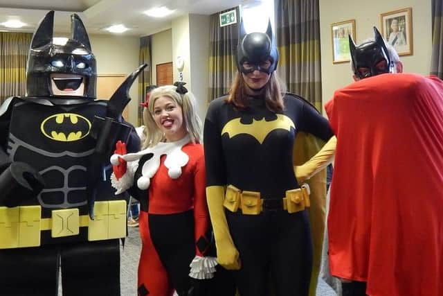 Caped Crusaders, Lego Batman, Harley Quinn, Batgirl and the Revd Kevin Ashby PHOTO: Supplied