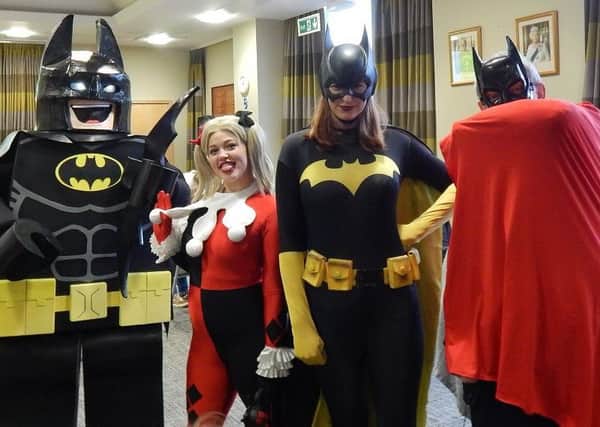 Caped Crusaders, Lego Batman, Harley Quinn, Batgirl and the Revd Kevin Ashby PHOTO: Supplied