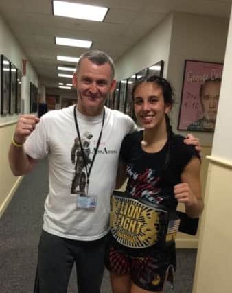 Iman Barlow pictured with dad and coach Mark and her 12th world title belt last year EMN-170802-144932002