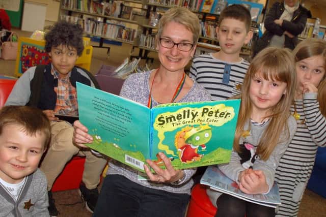 Librarian Kim Wallis reads to children at the activities afternoon PHOTO: Tim Williams