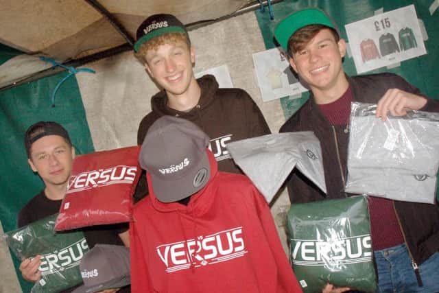 Versus co-owner Joe Twelvetree and friends Nathan Cridland and Matthew Creighton on their stall PHOTO: Tim Williams