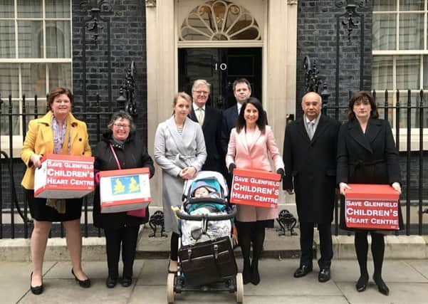 A delegation delivers a 130,000-name petition to 10 Downing Street as part of a campaign to keep the children's heart unit open at Glenfield Hospital in Leicester EMN-171002-103756001