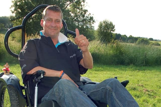Stewart Sparling testing out the life-changing specialised wheelchair he got in 2013 PHOTO: Tim Williams EMN-170215-165038001