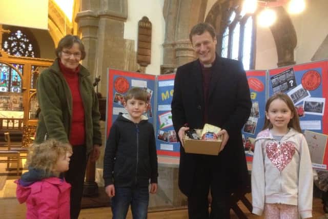Bishop Martyn receives his small hamper of local goodies
PHOTO: Supplied