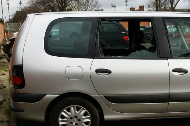 A car window smashed by a flying slate in the King's Head car park in Melton during Storm Doris EMN-170223-154453001