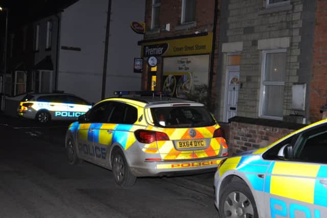 Police outside Craven Street Stores. Photo: Jonathan McGrady/JM News.