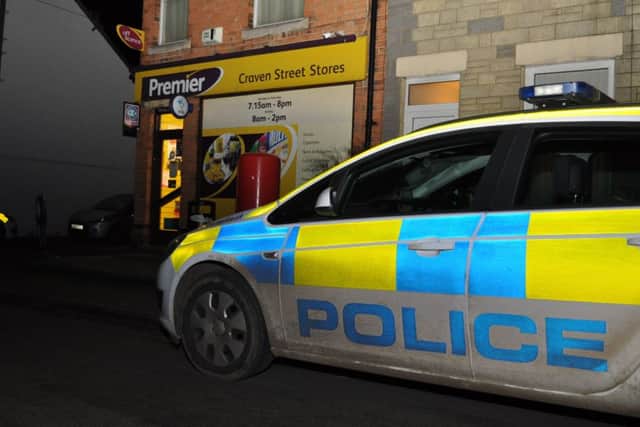 Police outside Craven Street Stores - Photo: Jonathan McGrady/JM News.