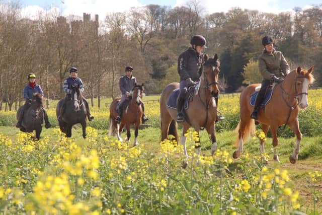 Belvoir Castle provides the scenic backdrop for the Macmillan ride
PHOTO: Tim Williams EMN-160419-120508001