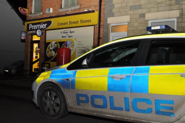 A police car parked outside Craven Street Stores on Wednesday evening following an armed robbery.
PHOTO Jonathan McGrady/JM News EMN-170603-093733001