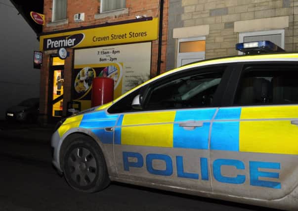 A police car parked outside Craven Street Stores on Wednesday evening following an armed robbery.
PHOTO Jonathan McGrady/JM News EMN-170603-093733001