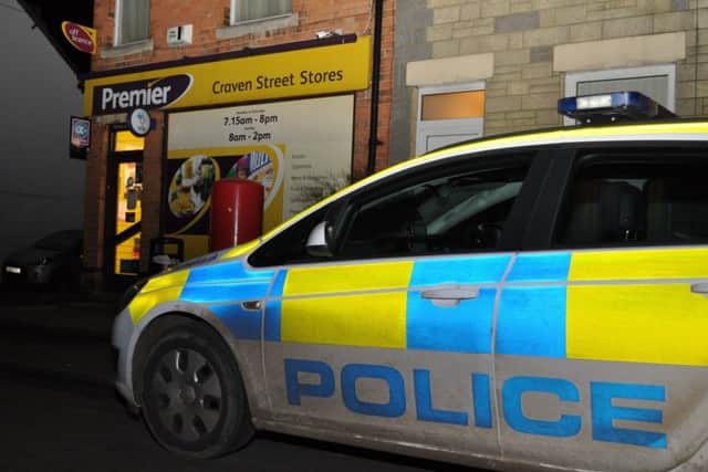 A police car parked outside Craven Street Stores on Wednesday evening following an armed robbery.
PHOTO Jonathan McGrady/JM News