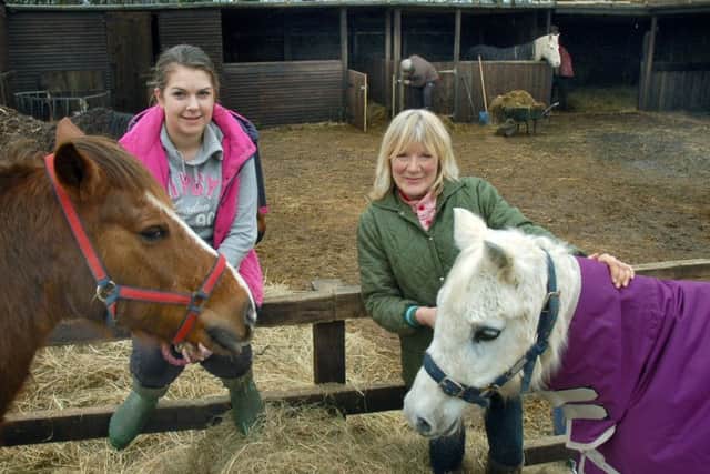 Carole Fielding with volunteer Jade Townend and a couple of resident ponies at Pablo's Horse Sanctuary PHOTO: Tim Williams