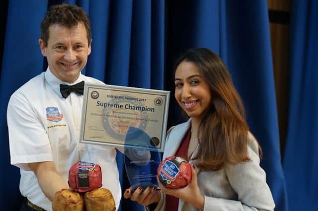 Stephen Hallam and brand manager Sunita Bala celebrate the Dickinson and Morris Melton Mowbray pork pie being named superme champion at the British Pie Awards, at Melton EMN-171003-165626001