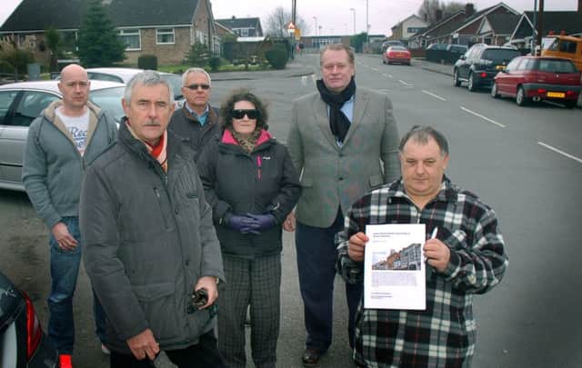Local resident Frank Duckworth with fellow dog fouling campaigners and Melton councillor Alan Pearson. EMN-170313-120840001