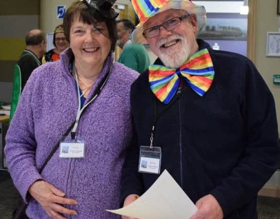 Helpers Liz and John Craig found some mad hats to go along in PHOTO: Supplied