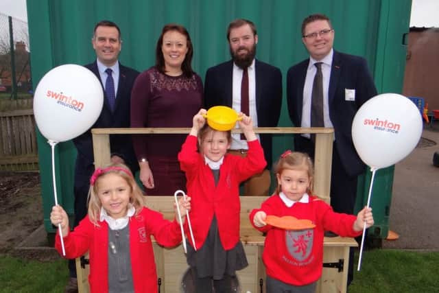 Jonathan Perkins, Sarah Child, deputy head Steve Nash and Bob Carvell with reception children at Brownlow Primary School PHOTO: Supplied