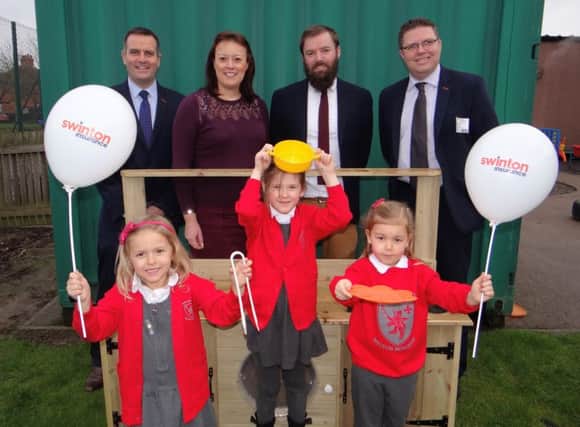 Jonathan Perkins, Sarah Child, deputy head Steve Nash and Bob Carvell with reception children at Brownlow Primary School PHOTO: Supplied
