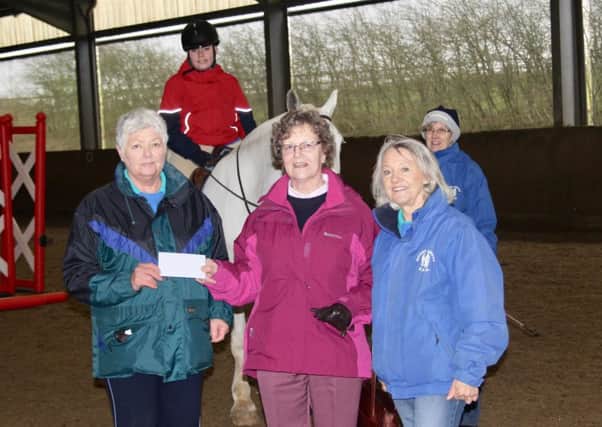 More than Â£2,000 is presented to the Mount Group RDA at Somerby by Birstall Golf Club's ladies' section EMN-170320-110440001