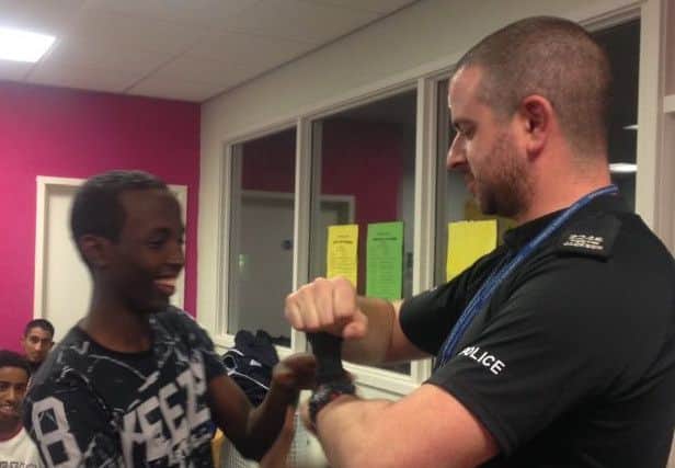 Pc Austin Jackson is shown working in the community for the LCFC Community Trust in Leicester EMN-170322-102901001