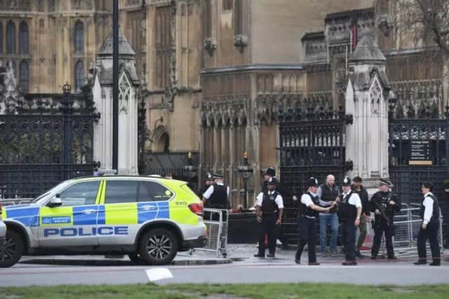 Police outside the Palace of Westminster, London. Picture: PA