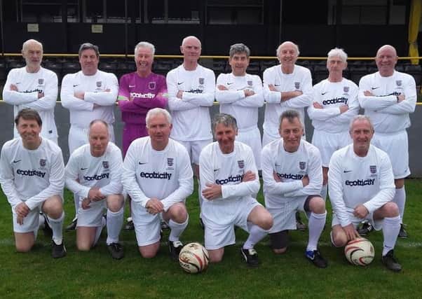 Goalkeeper Adrian Stannard (back row, third from left) lines up with England's first-ever over 65s squad EMN-170329-093128002