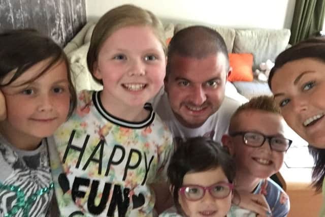 Dedicated father and husband Austin Jackson with his four children and wife Simone EMN-170330-140901001