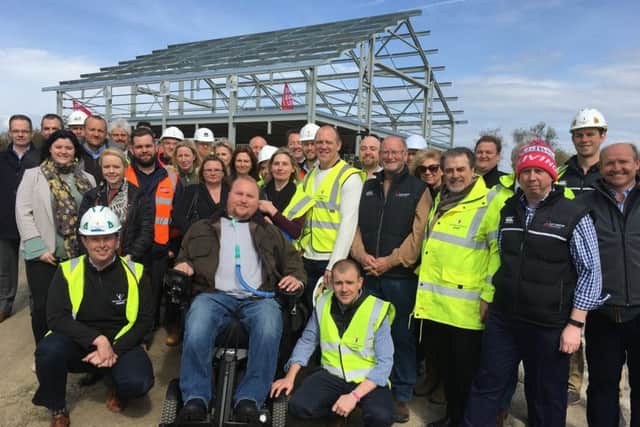 Former England rugby captain Mike Tindall, Matt Hampson and his foundation members and partners at the topping out ceremony for the Get Busy Living Centre at Burrough-on-the-Hill EMN-170331-155529001