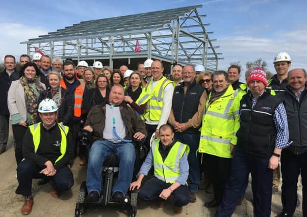 Former England rugby captain Mike Tindall, Matt Hampson and his foundation members and partners at the topping out ceremony for the Get Busy Living Centre at Burrough-on-the-Hill EMN-170331-155529001