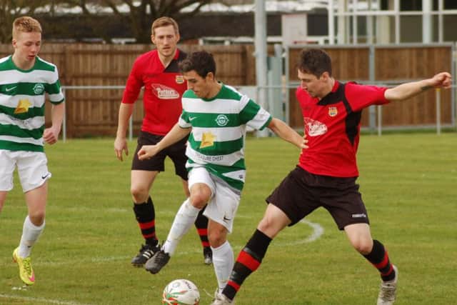 Mike Hendey gets a challenge in during Saturday's win EMN-170304-085507002