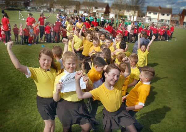 Pupils at Sherard School in Melton form a human ribbon for World Autism Awareness Week EMN-170304-143005001
