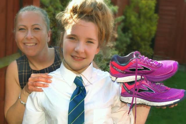Amy Parr and daughter Lillie - Amy is running the London Marathon for the Epilepsy Society because her daughter is a sufferer EMN-170404-095037001