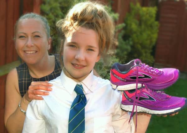 Amy Parr and daughter Lillie - Amy is running the London Marathon for the Epilepsy Society because her daughter is a sufferer EMN-170404-095037001