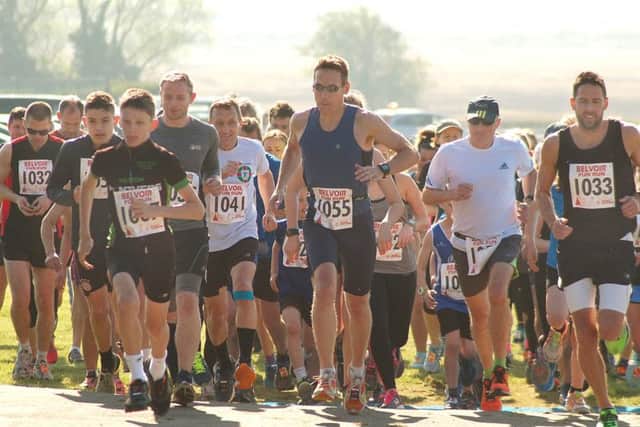 Fun runner winner David Hamdorff (blue vest) leads the way at the start EMN-171104-124135002