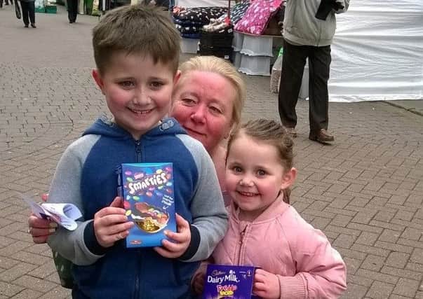 The competition winners claim their Easter eggs PHOTO: Supplied