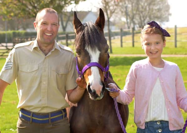Ben Moore, who is riding a charity flat race, with daughter Grace and her pony Bella EMN-171004-132406001