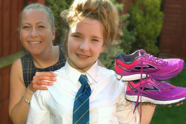 Amy Parr and daughter Lillie - Amy is running the London Marathon for the Epilepsy Society because her daughter is a sufferer PHOTO: Tim Williams