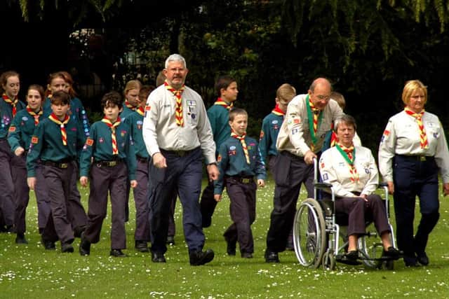 Scouts and Beavers march to the bandstand in Play Close, Melton, during the annual St George's Day Scout parade EMN-170424-124411001