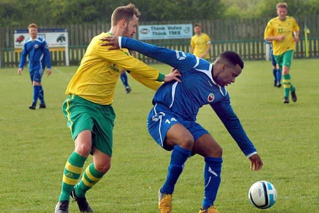 Aaron Ridout tries to get to grips with West Bridgford sub Carl Westcarr EMN-170425-114742002