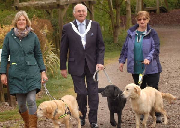 Sue Brown and Pauline Jones set off for a dog walk with Mayor of Melton, Councillor David Wright, as the town's pet-friendly campaign gets into full swing EMN-170205-114222001