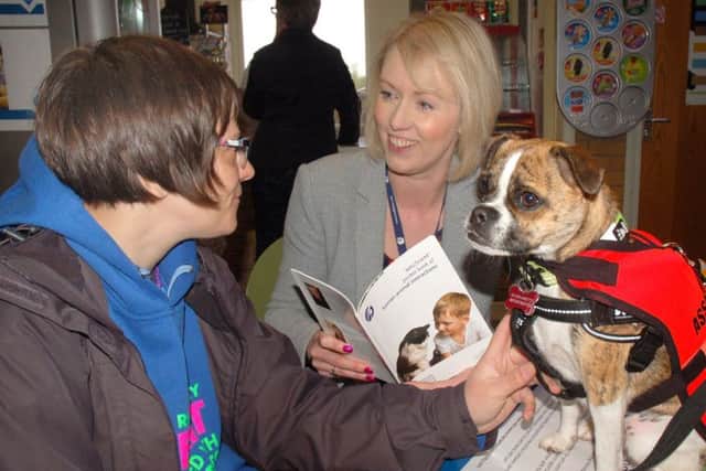 Henley Hughes and dog Lotti get some advise from Sara Kelly, of Waltham Petcare Centre, as the town's pet-friendly campaign gets into full swing EMN-170205-114234001