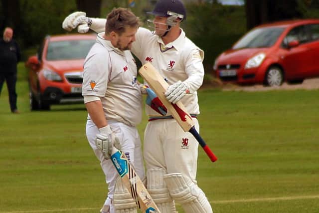 Park captain Charlie Madden congratulates Stuart Rose (left) on his century EMN-170205-112524002