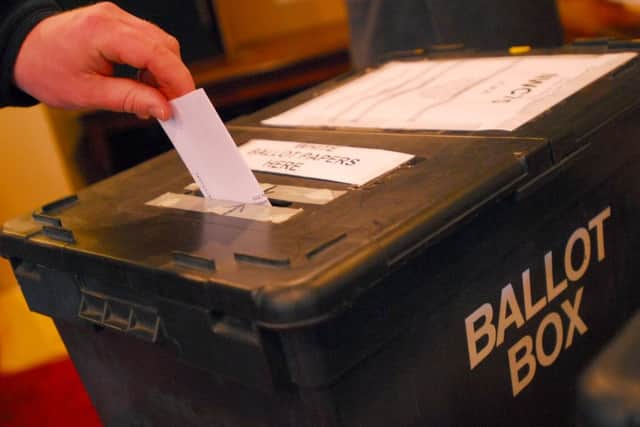 Residents cast their votes in the general election at the polling station in the Botolph Arms pub on Oundle Road ENGSUS00120120430114532