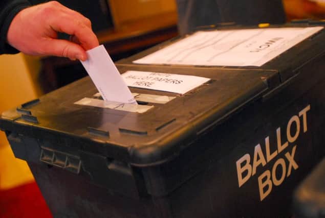 Residents cast their votes in the general election at the polling station in the Botolph Arms pub on Oundle Road ENGSUS00120120430114532