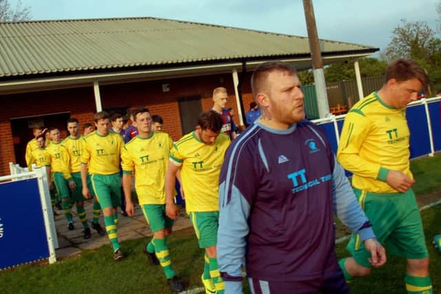 Jamie Witham and the Holwell team make their way out onto the Holmes Park pitch EMN-170205-231851002